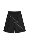 Black wide-leg shorts with diagonal rows of silver studs and frayed raw hems