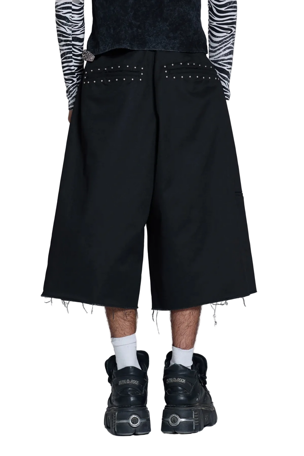 Black wide-leg cropped pants with silver stud detailing on the back pockets