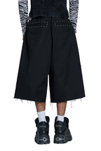 Black wide-leg cropped pants with silver stud detailing on the back pockets