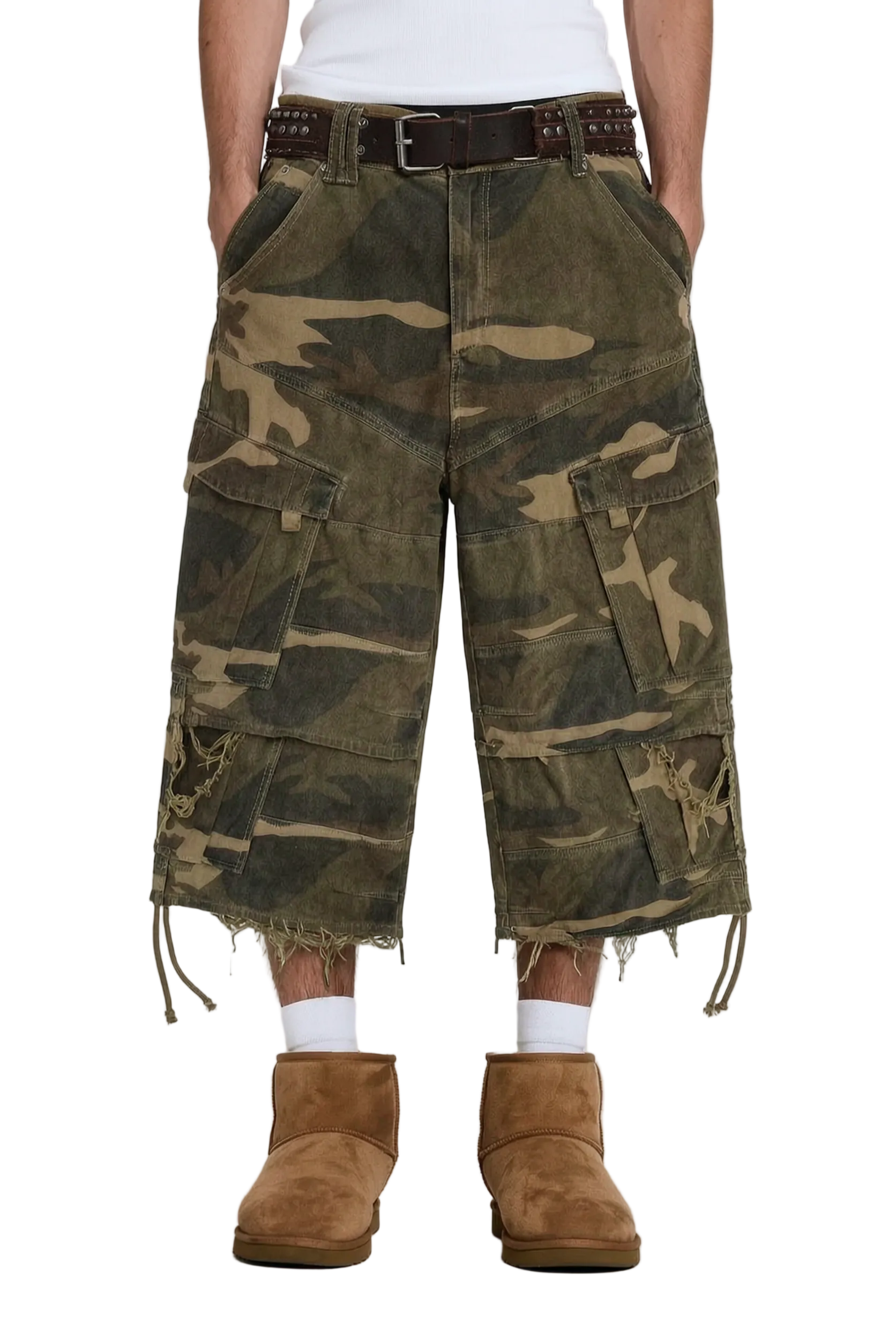 A person wearing oversized camouflage cargo shorts with a raw, frayed hem